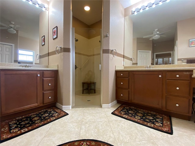 bathroom featuring walk in shower, tile patterned flooring, vanity, and ceiling fan