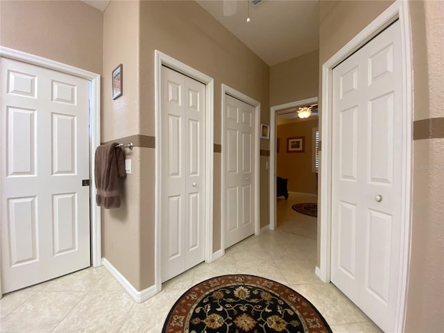 hallway featuring light tile patterned floors