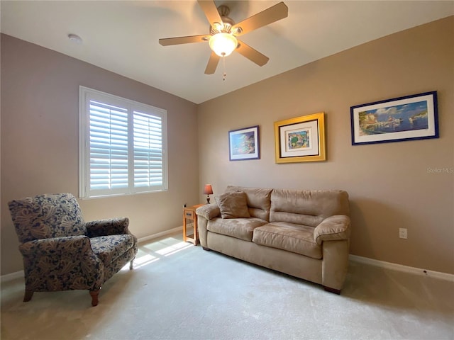 living room with ceiling fan and light carpet