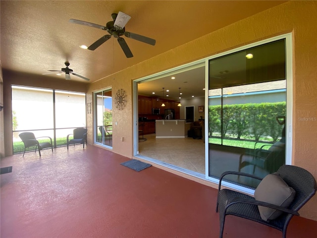 view of patio with ceiling fan