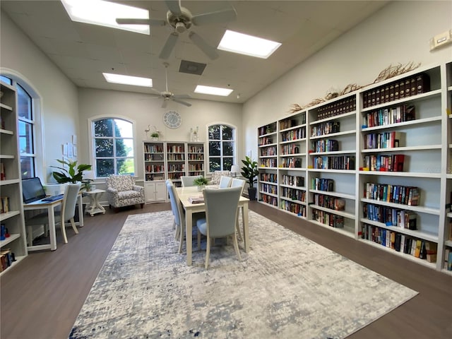 office area with dark wood-type flooring and ceiling fan