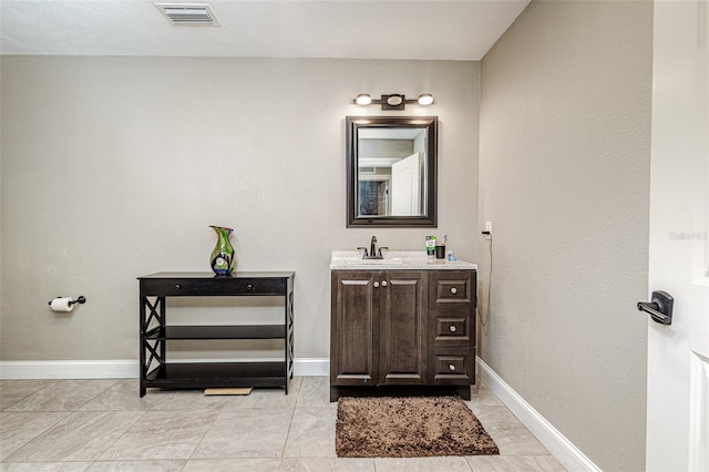 bathroom featuring tile flooring and oversized vanity