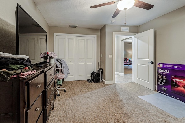 carpeted office featuring ceiling fan