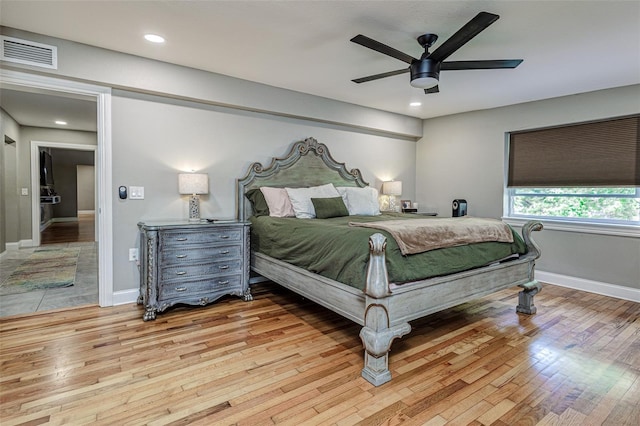 bedroom featuring ceiling fan and light hardwood / wood-style floors