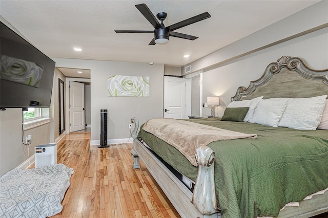 bedroom featuring light hardwood / wood-style floors and ceiling fan