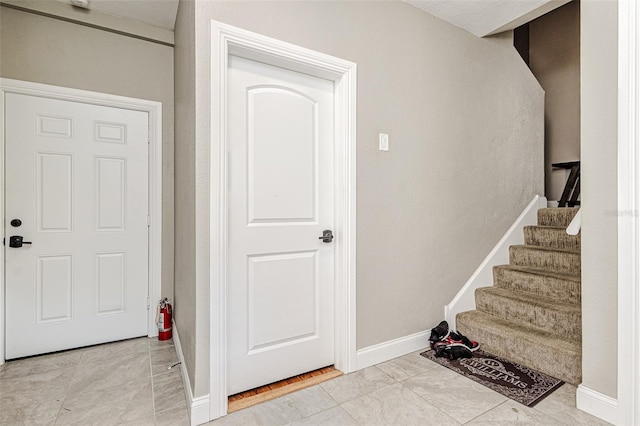 entryway with light tile floors