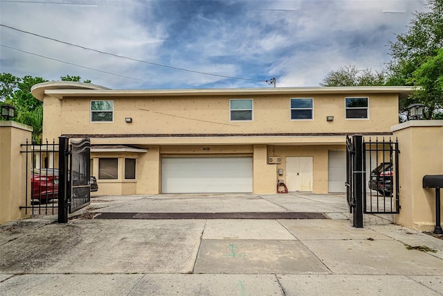 townhome / multi-family property featuring a garage