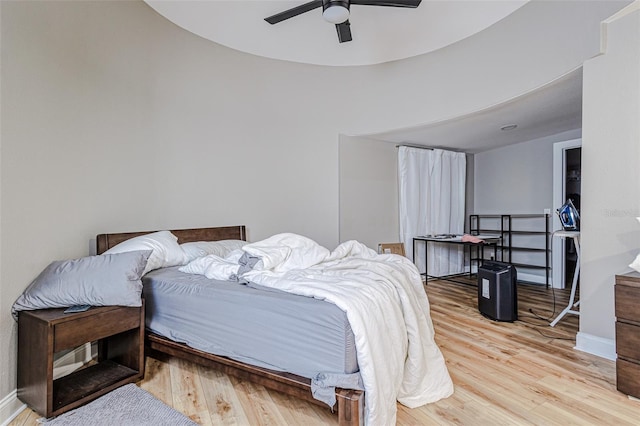 bedroom featuring light hardwood / wood-style flooring and ceiling fan