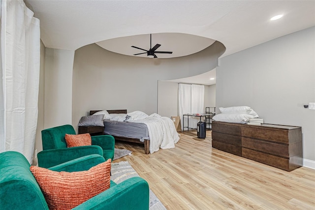 bedroom featuring ceiling fan and light hardwood / wood-style flooring