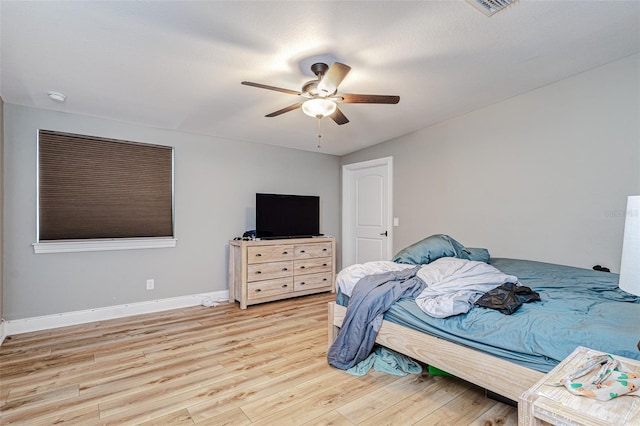 bedroom featuring ceiling fan and light wood-type flooring