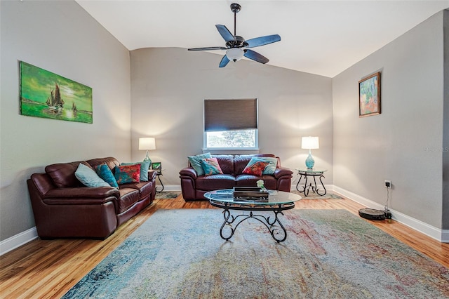 living room with ceiling fan, lofted ceiling, and light wood-type flooring
