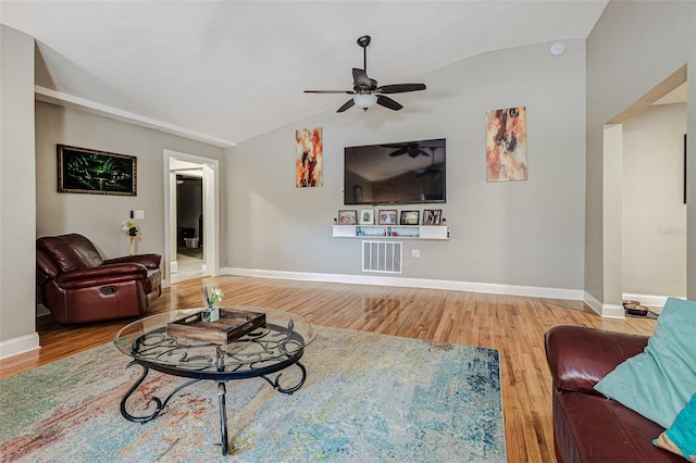 living room featuring ceiling fan, light wood-type flooring, and lofted ceiling