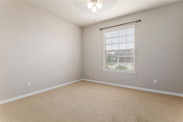 unfurnished room with light carpet and ceiling fan