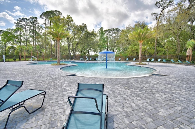 view of pool featuring a patio area and pool water feature