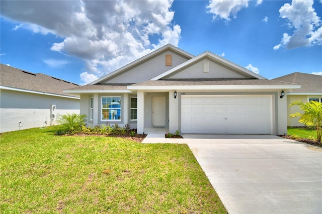 view of front of property featuring a front lawn and a garage