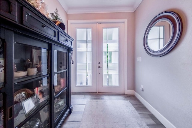 doorway to outside featuring crown molding and french doors