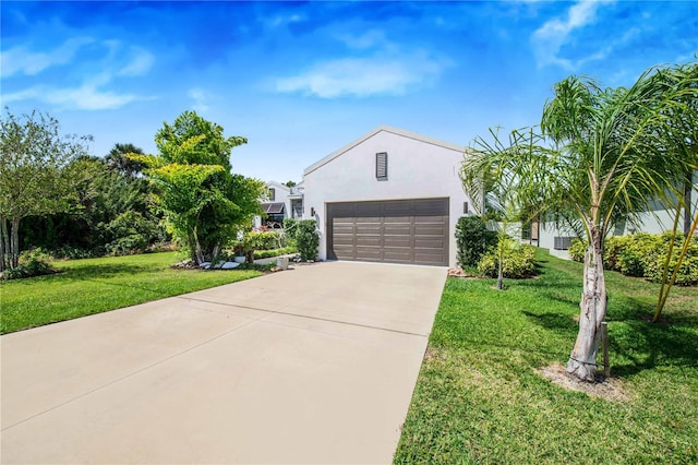 view of front facade featuring a front yard and a garage