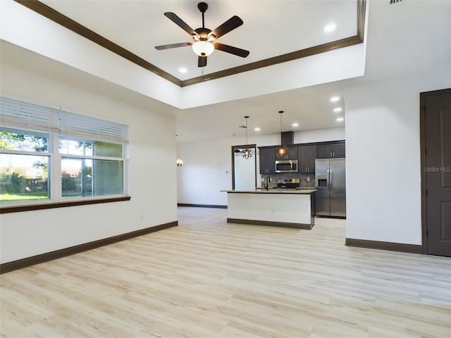 unfurnished living room with ornamental molding, light hardwood / wood-style flooring, ceiling fan, and sink