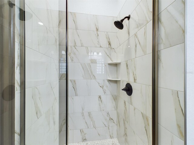 bathroom featuring an enclosed shower