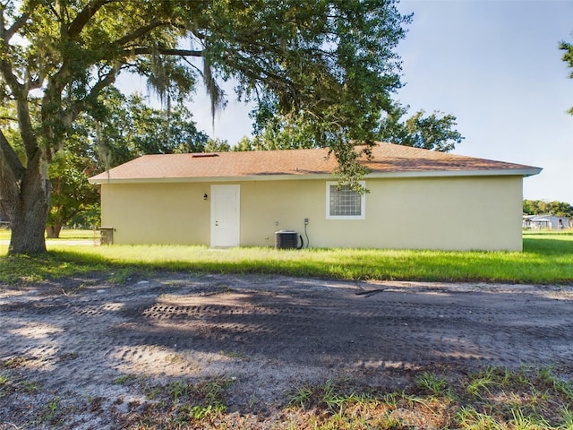 view of side of home featuring cooling unit