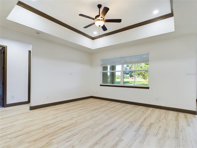 unfurnished room with crown molding, ceiling fan, and light wood-type flooring