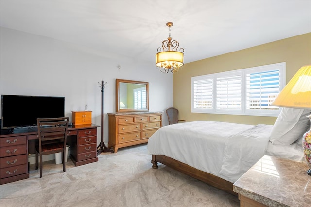 bedroom featuring an inviting chandelier