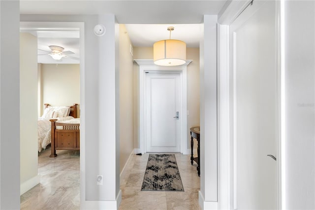 interior space featuring ceiling fan and light tile floors