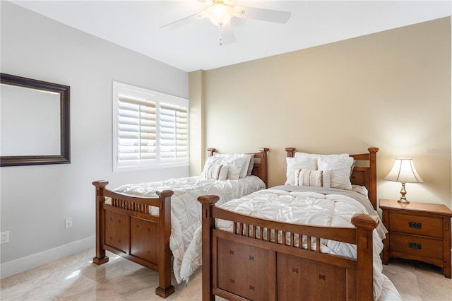 bedroom with ceiling fan and light tile floors