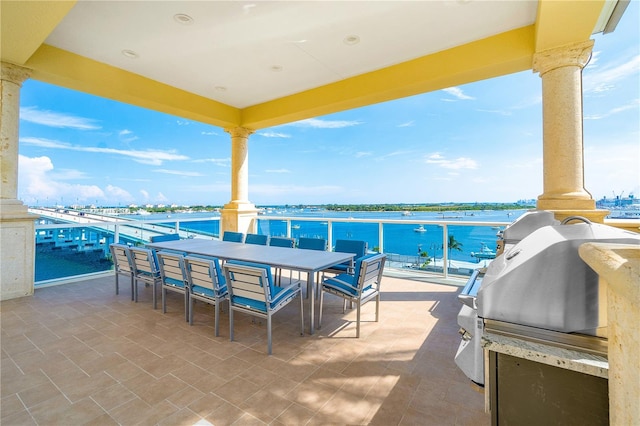 view of patio with a water view