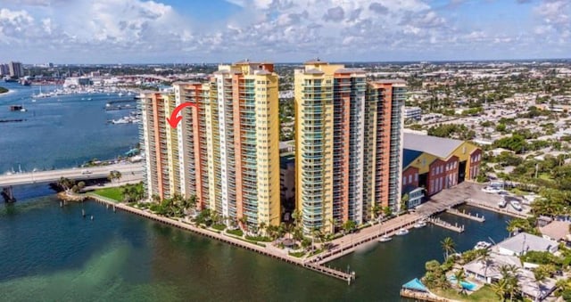 birds eye view of property with a water view