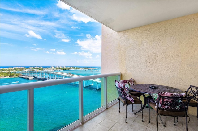 balcony featuring a water view