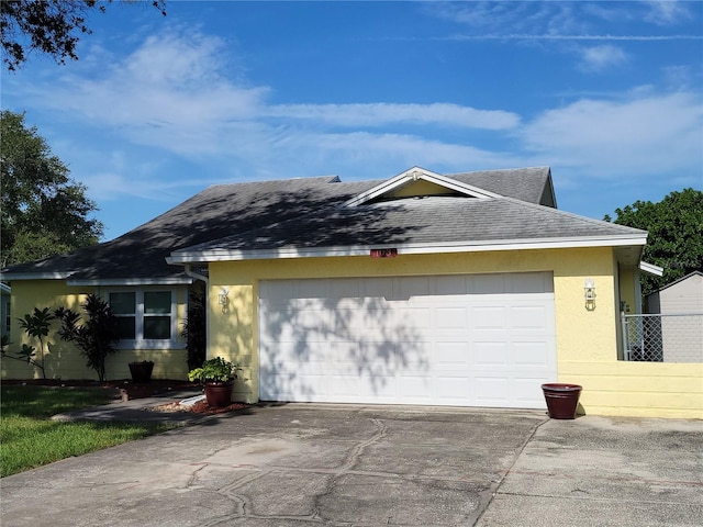 ranch-style house featuring a garage