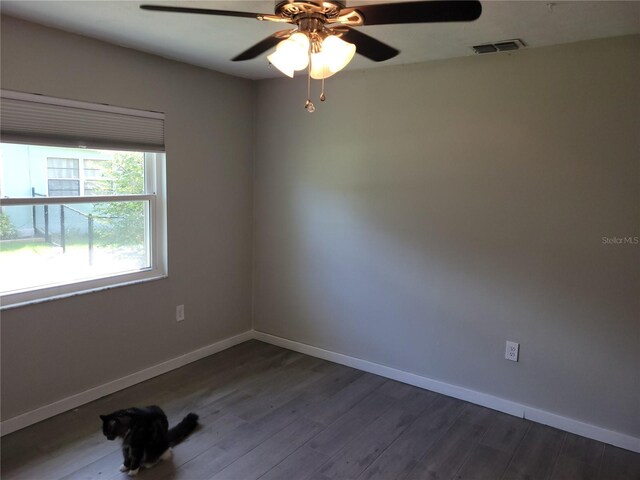 unfurnished room featuring ceiling fan and hardwood / wood-style floors