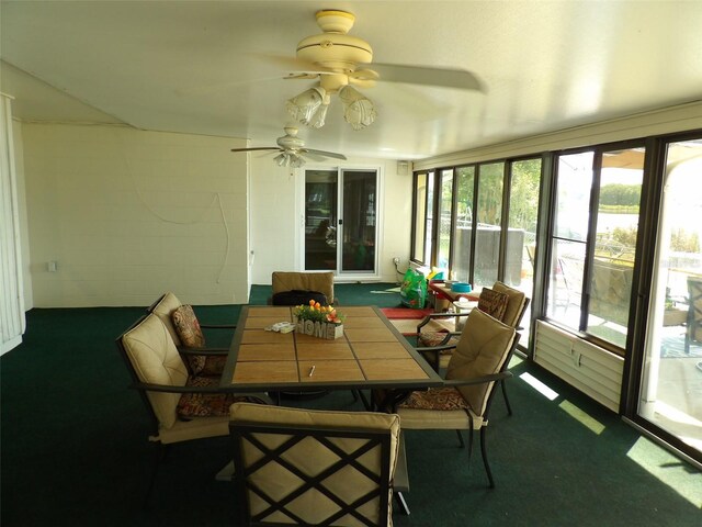 sunroom / solarium featuring ceiling fan and a healthy amount of sunlight