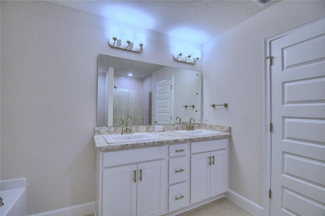 bathroom with independent shower and bath, a textured ceiling, tile flooring, and dual bowl vanity