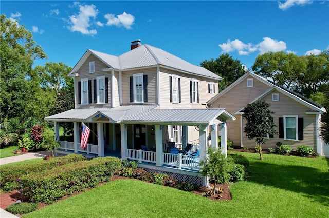 view of front facade featuring a porch and a front lawn