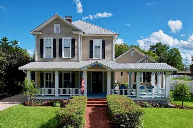 view of front of house with a front lawn and a porch