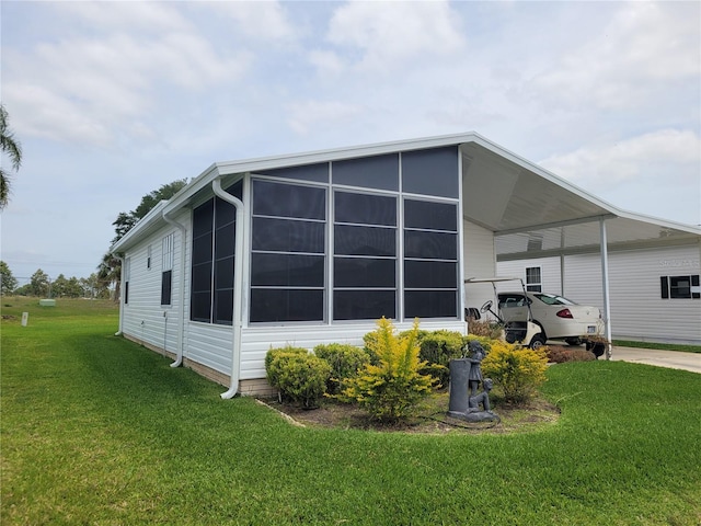 view of property exterior featuring a carport and a yard