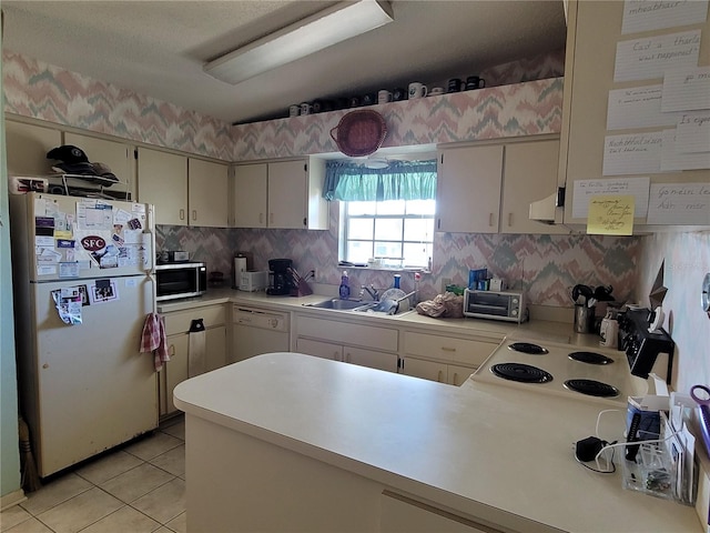 kitchen featuring light tile flooring, tasteful backsplash, white appliances, sink, and kitchen peninsula