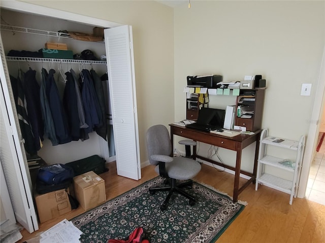 office with light hardwood / wood-style floors