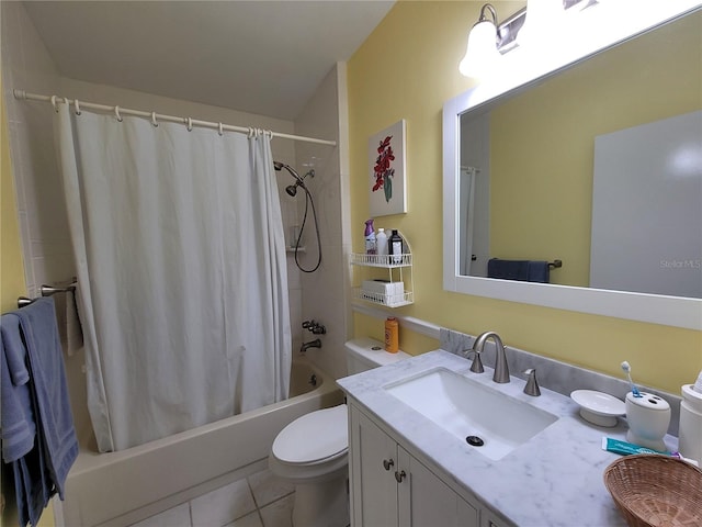 full bathroom with toilet, vanity with extensive cabinet space, tile floors, and shower / tub combo