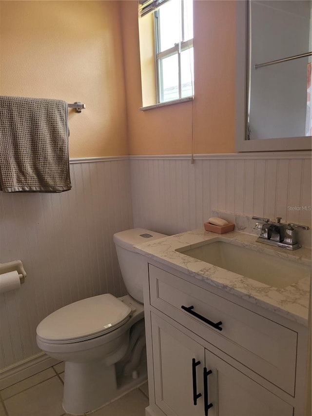 bathroom featuring oversized vanity and toilet