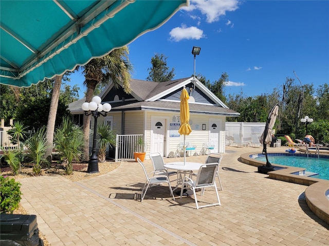 view of terrace featuring a fenced in pool