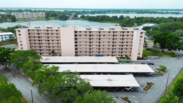 birds eye view of property with a water view