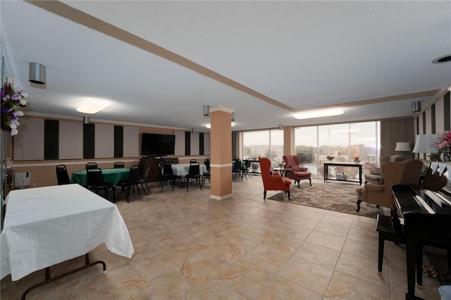 interior space featuring ornate columns and light tile flooring