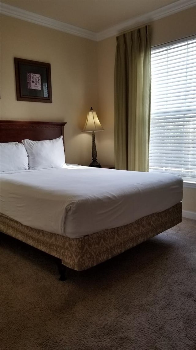 carpeted bedroom featuring ornamental molding