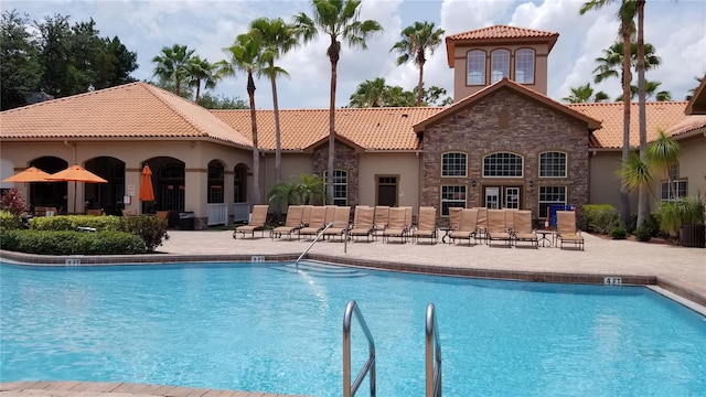 view of swimming pool with a patio