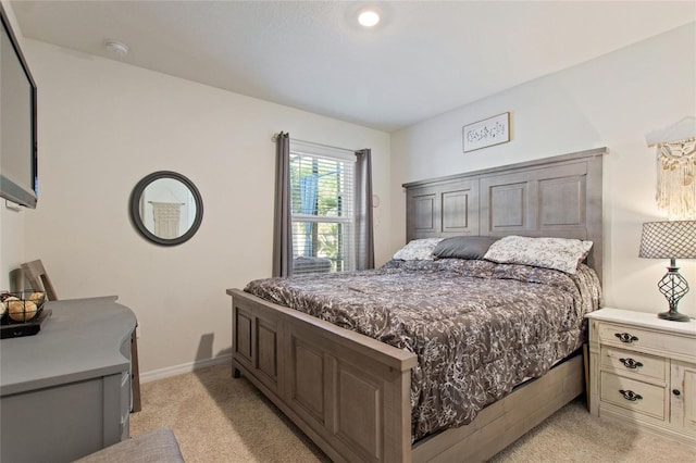 bedroom with light carpet