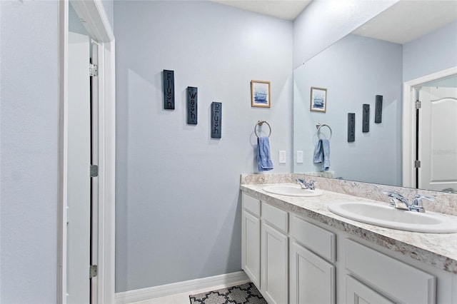 bathroom with vanity and tile patterned floors