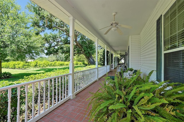 view of patio featuring ceiling fan and a porch